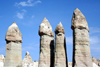 Turkey - Greme (Capadocia): fairy chimneys - Unesco world heritage site - pinnacles of eroded volcanic ash - Love Valley: four fairy chimneys - photo by C.Roux