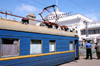 Odessa, Ukraine: local electrical power train at the Central Train Station - sign honouring Odessa's statue as an 'Hero City' - photo by K.Gapys