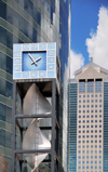 Kansas City, Missouri, USA: KCPL Clocktower with an energy-generating wind turbine - Power and Light District - on the background left is the Town Pavilion skyscraper designed by HNTB architects, background right H&R Block tower - photo by M.Torres