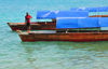 Stone Town, Zanzibar, Tanzania: idle water taxis seen from Mizingani Road - photo by M.Torres