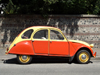 Le Havre, Seine-Maritime, Haute-Normandie, France: red and yellow Citroen 2CV against and old wall - 'deux chevaux' - Normandy - photo by A.Bartel