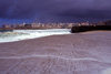 Galicia / Galiza - A Corua: in the surf - waterfront and city skyline in the background - photo by S.Dona'